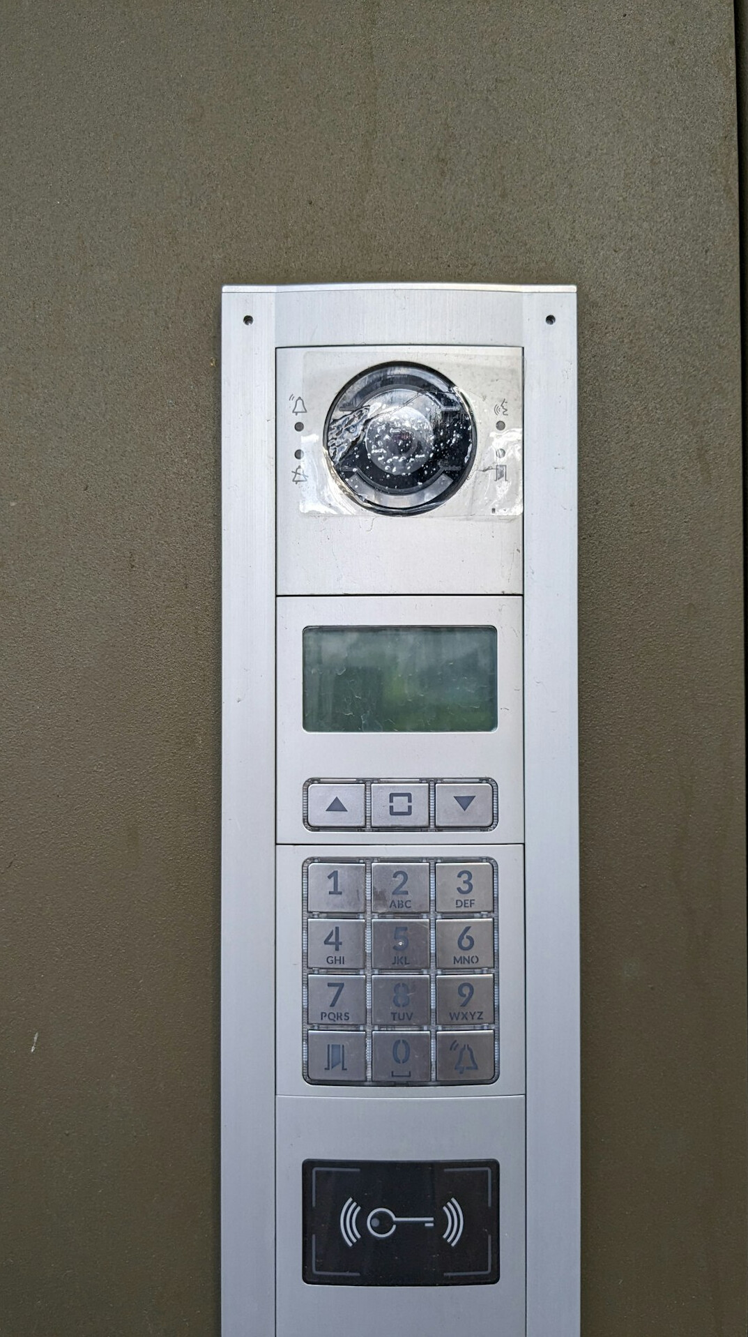Intercom talkback panel and headset on a production desk